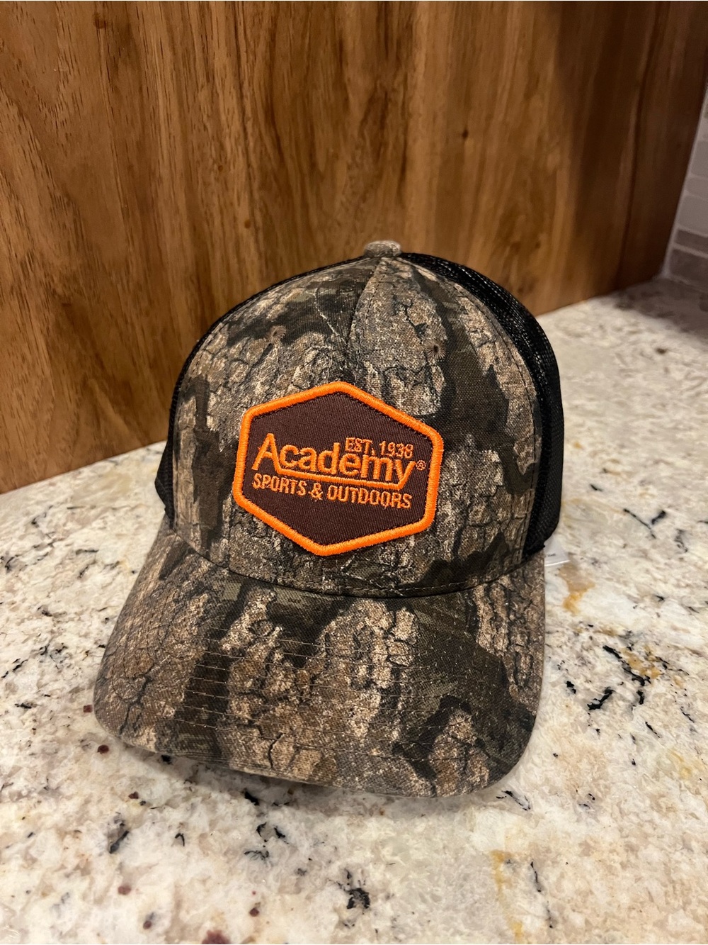 Academy Sports & Outdoors Men's Camo Trucker Hat - Black/Brown with Orange Logo